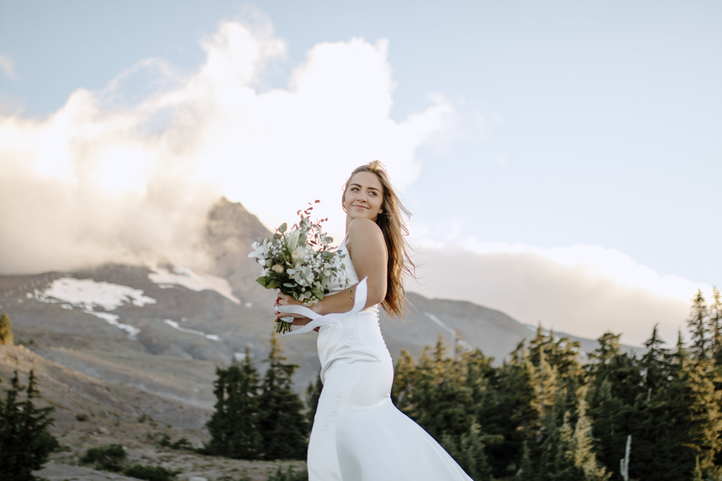 elopement photoshoot at Mt. Hood, bride holding wedding bouquet on mountain in oregon, destination elopement photography
