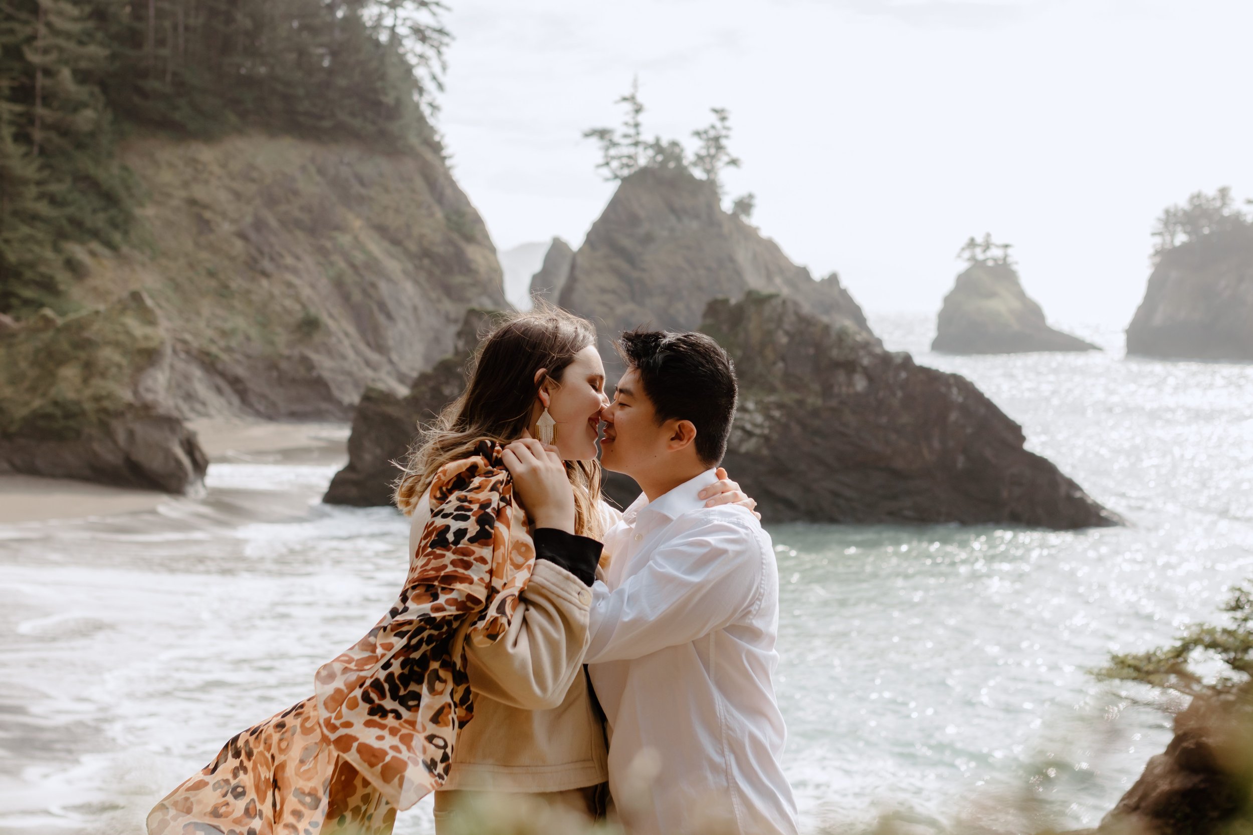 couple kissing on beach in Oregon, film photographer in Oregon