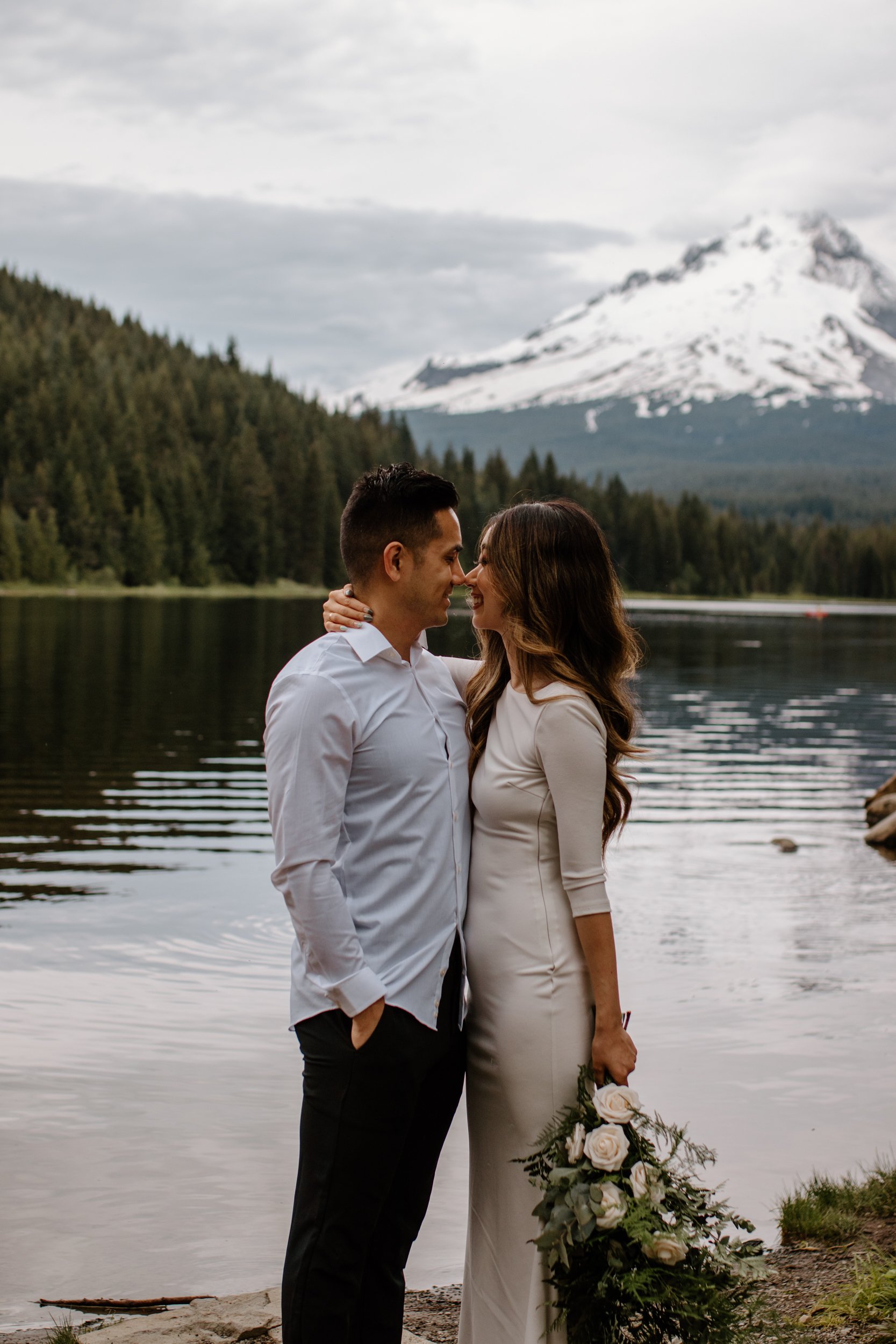 couple posing in front of river in Oregon, film photographer in Oregon