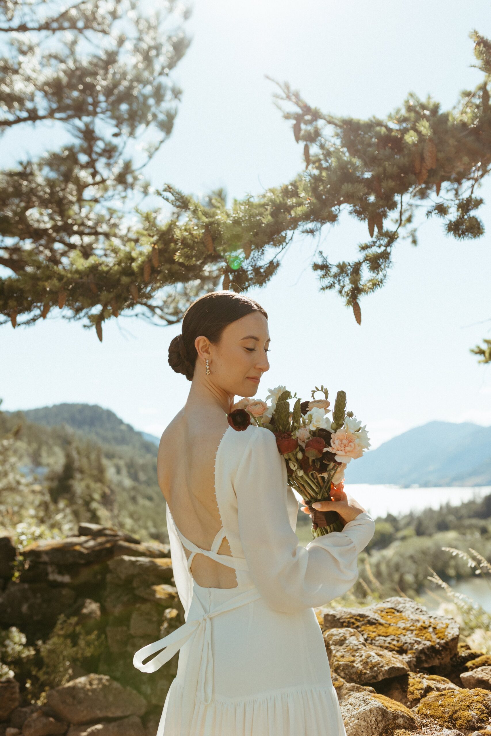 Woman holding bouquet at wedding venue in Oregon
