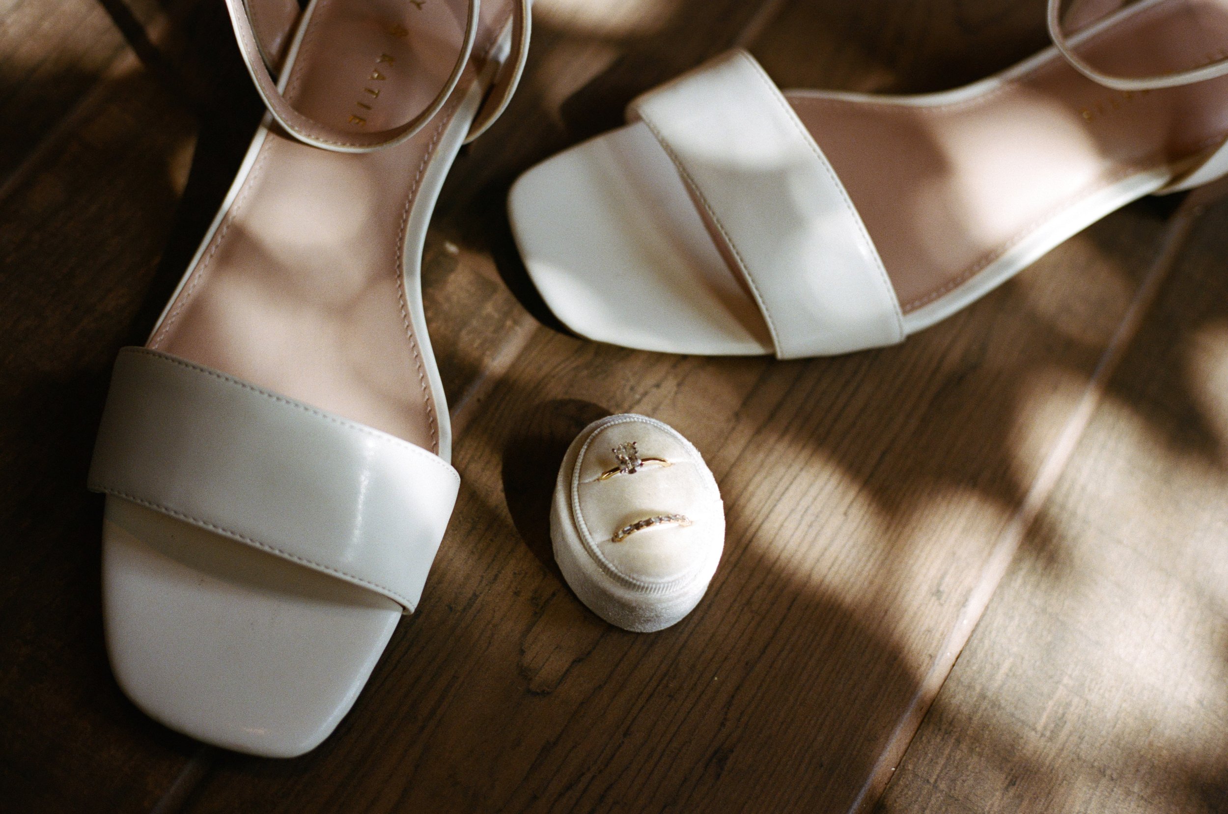 wedding detail photos with ring and heels from bride. oregon coast wedding photographer