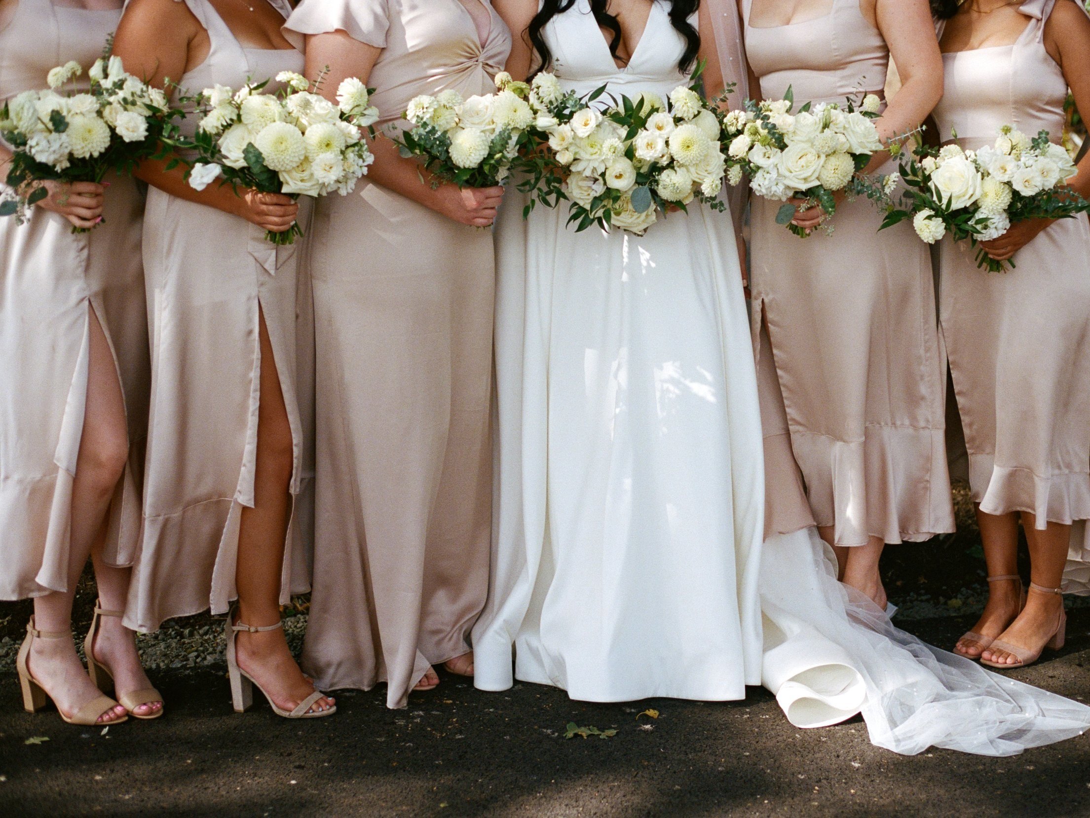 bridesmaids holding wedding bouquets of flowers for wedding photoshoot. Film photographer in Oregon