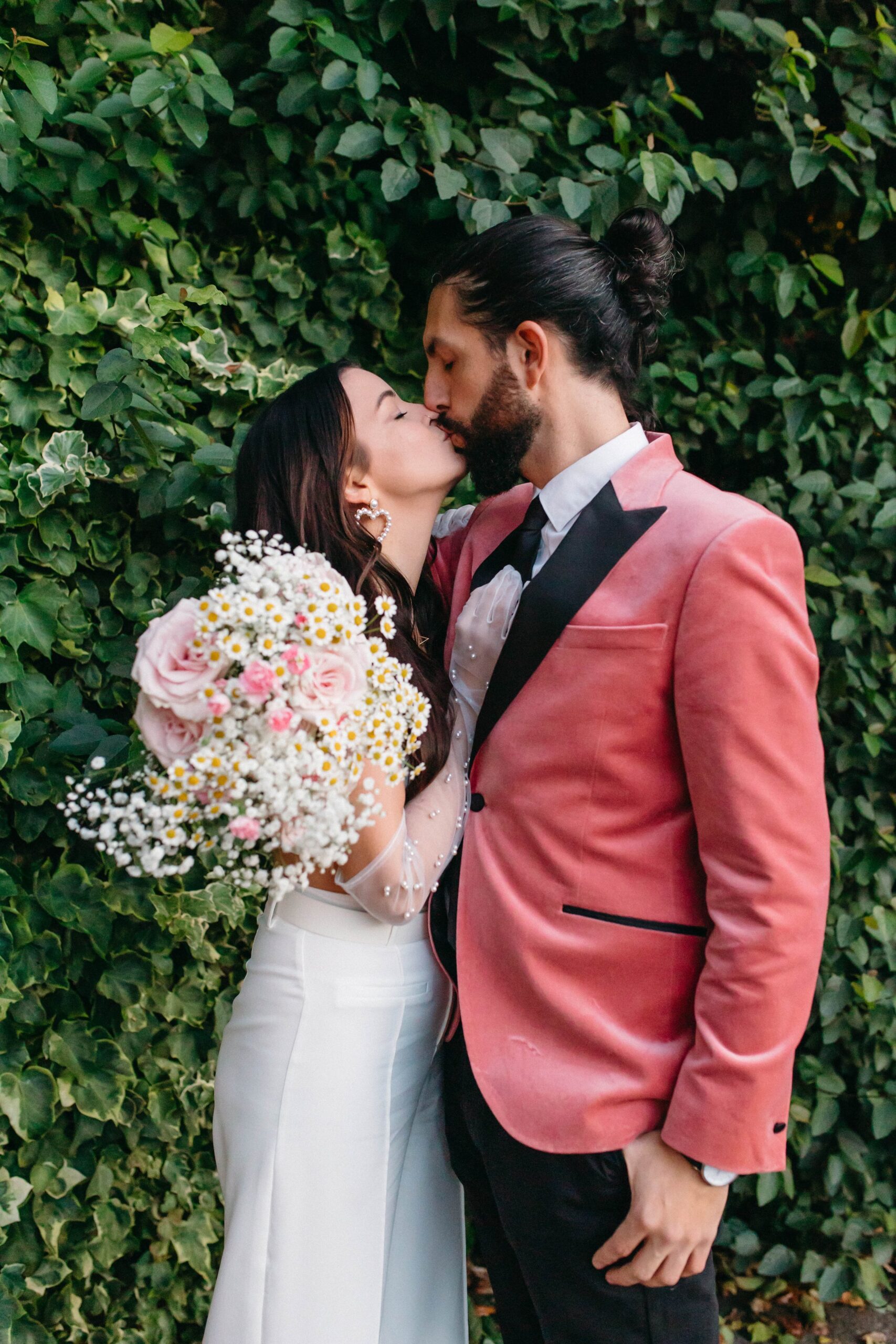  funky, modern, engagement photoshoot, neon signs, fun earrings, the unique couple poses, vegas inspired elopement nasty gal two-piece set, colorful suit, pearl gloves, movie theater, vintage, retro 