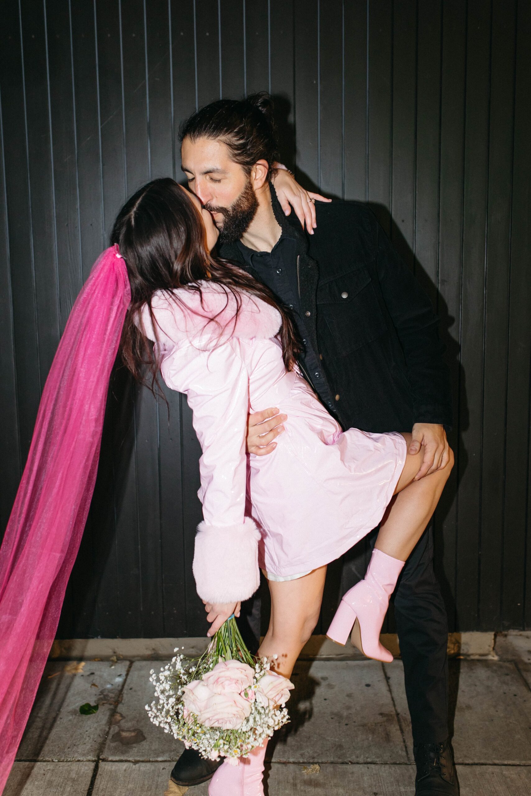 funky, modern, engagement photoshoot, neon signs, fun earrings, the unique couple poses, vegas inspired elopement nasty gal two-piece set, colorful suit, pearl gloves, movie theater, vintage, retro 
