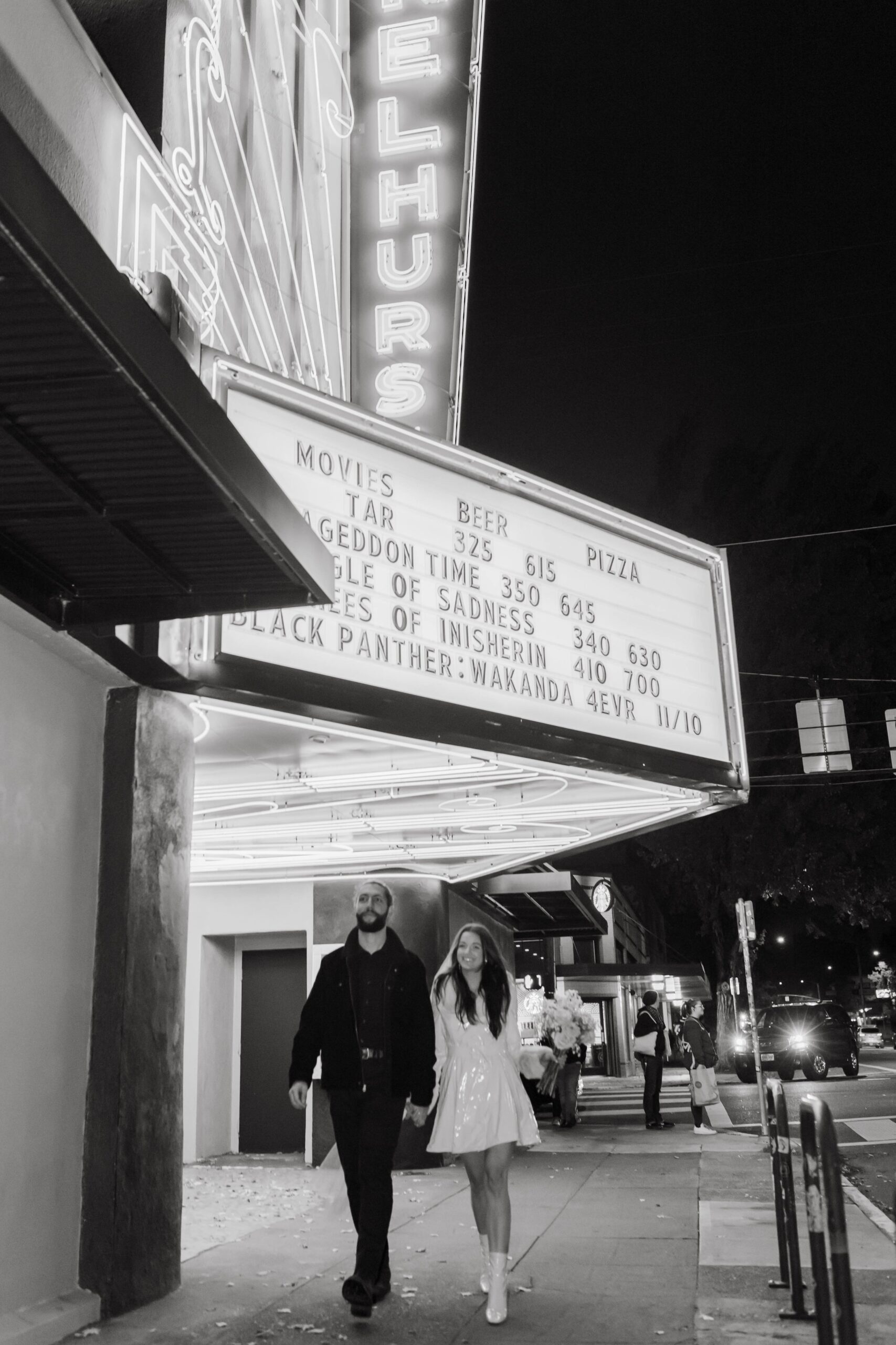  funky, modern, engagement photoshoot, neon signs, fun earrings, the unique couple poses, vegas inspired elopement nasty gal two-piece set, colorful suit, pearl gloves, movie theater, vintage, retro 