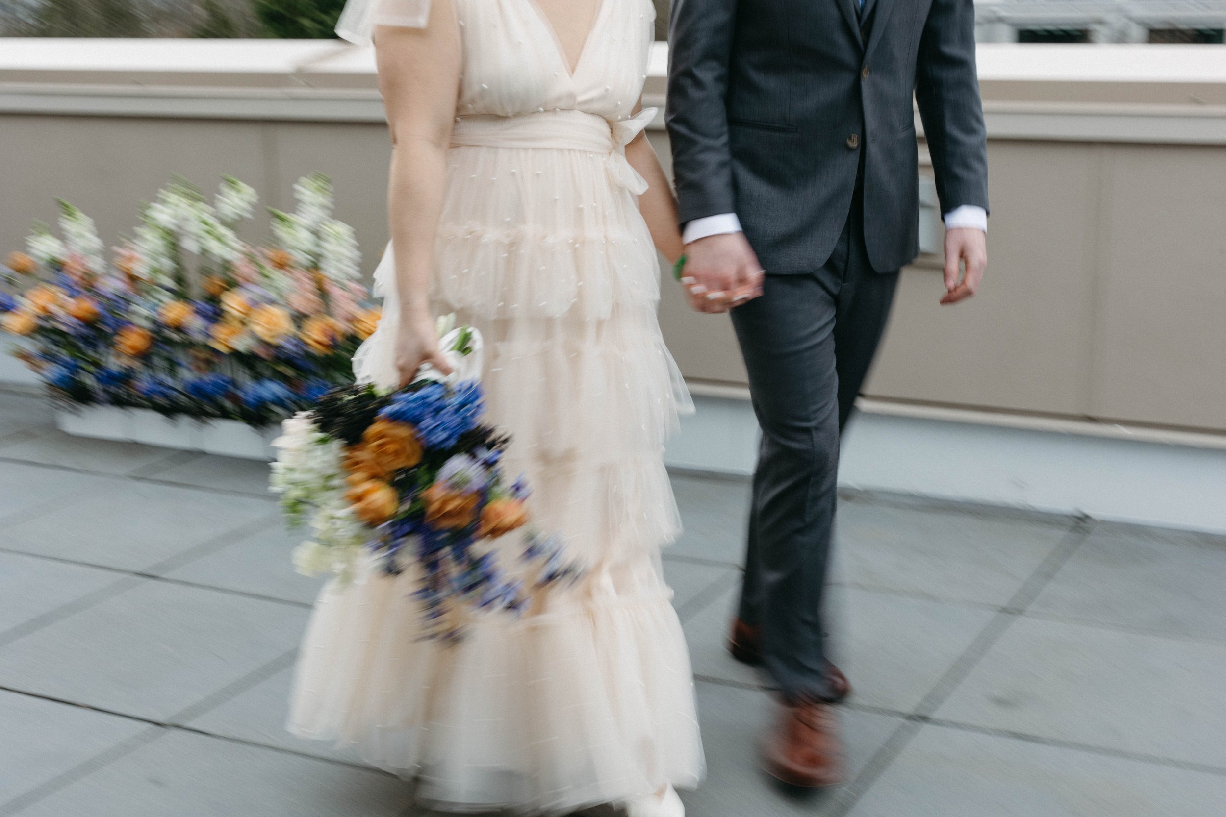  colorful whimsical small wedding elopement in Portland, Oregon. Lolo pass hotel. Purple, blue, and orange floral arrangement, fine china, beautiful place setting, private rooftop vows 